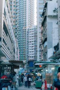 People walking on street in city