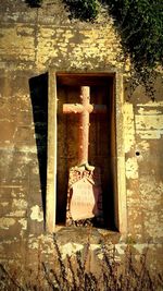 Close-up of sculpture hanging outside temple