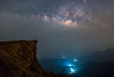 Scenic view of mountains against sky at night