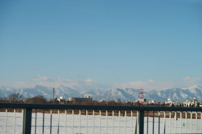 Scenic view of mountains against blue sky