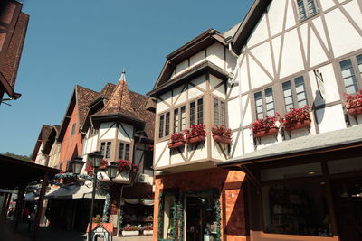 Low angle view of buildings against clear sky