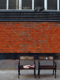 Two chairs on sidewalk