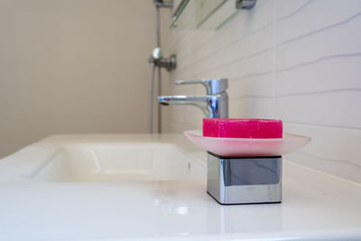 Close-up of faucet in bathroom