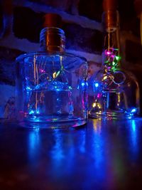 Close-up of glass bottles on table