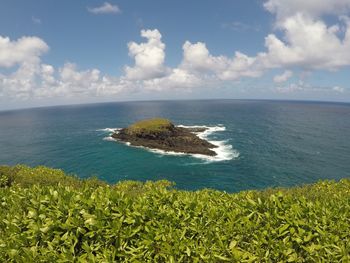 Scenic view of sea against cloudy sky