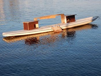 High angle view of boat floating on lake