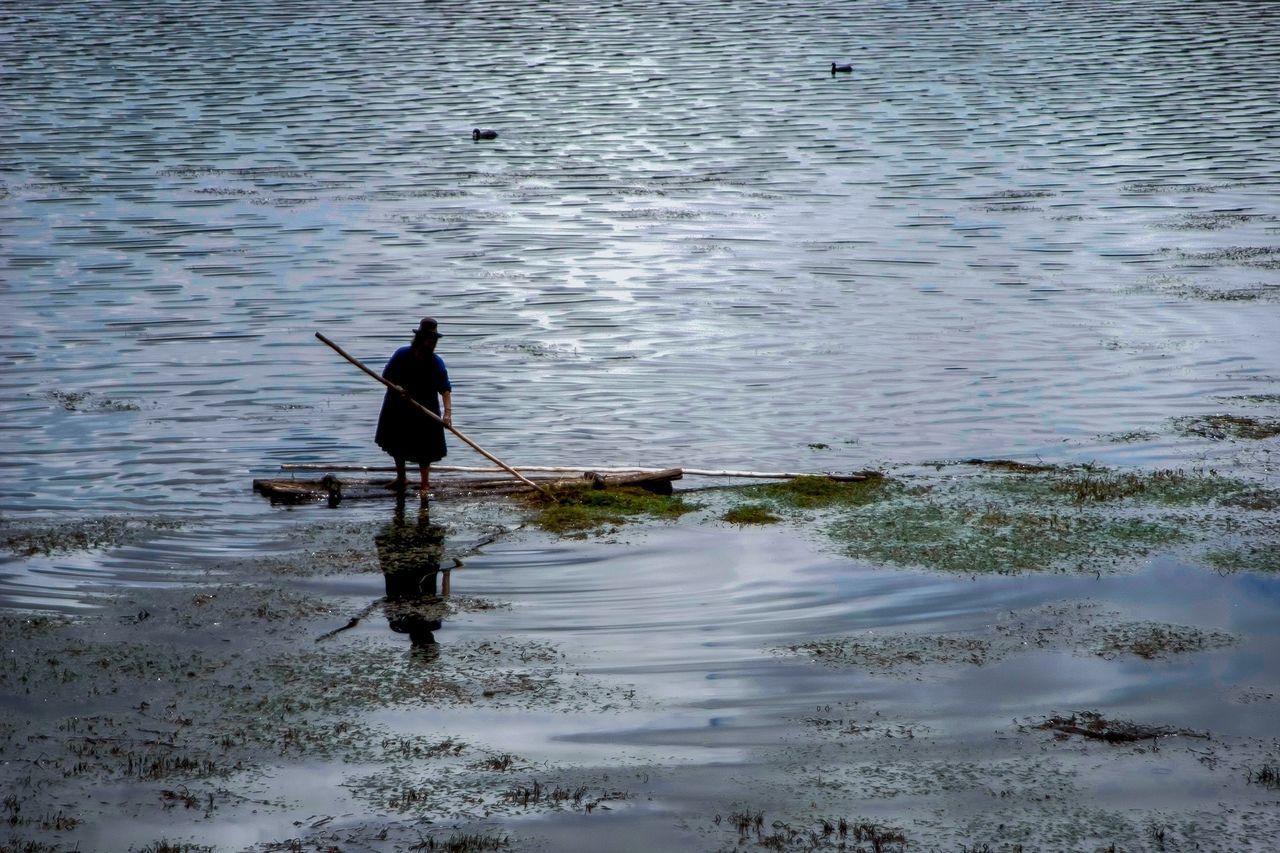 SILHOUETTE MAN ON SHORE