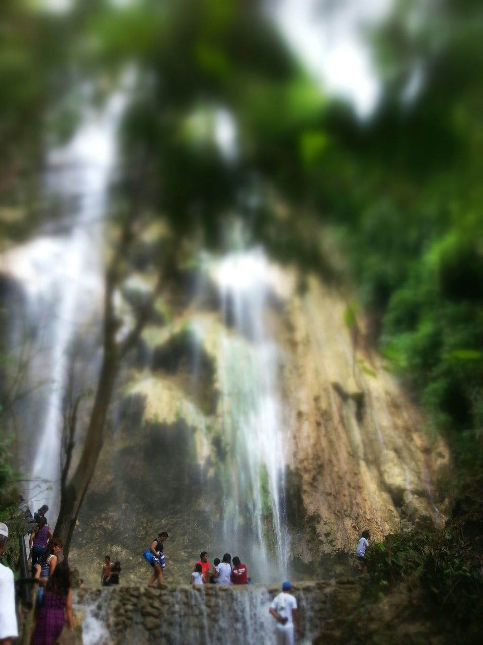 lifestyles, leisure activity, large group of people, motion, person, men, nature, tree, rock - object, forest, outdoors, selective focus, waterfall, day, blurred motion, high angle view, walking, beauty in nature, water