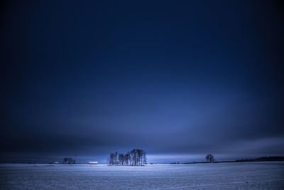 Dark winter scenery in early morning. snowy landscape during twilight.