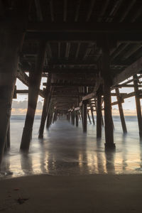 Low angle view of bridge at calm sea