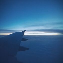 Cropped image of airplane over landscape