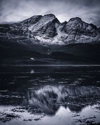 Scenic view of lake against sky during winter