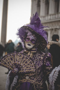 Rear view of woman wearing mask