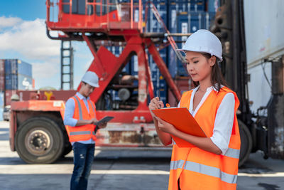 Young woman working at construction site