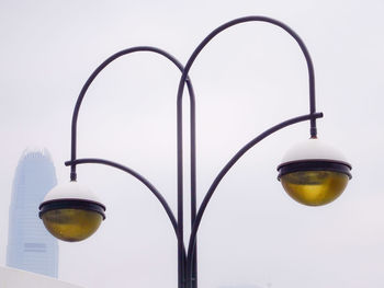 Low angle view of street light against sky