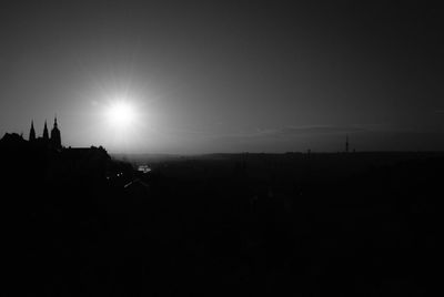 Silhouette landscape against clear sky during sunset