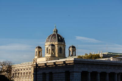 Low angle view of buildings against clear blue sky