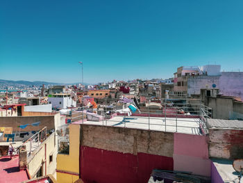 Good morning tangier - high angle view of townscape against blue sky