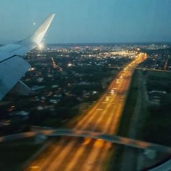 Cropped image of airplane flying over city