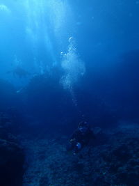 Person swimming in sea