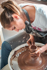 Woman working in mud