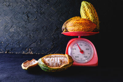 Close-up of food on table against black background