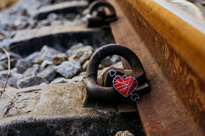 Red heart on the hay beside the train