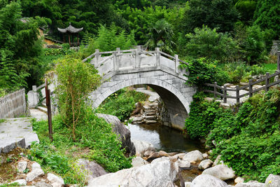 Photo of a stone bridge over a stream