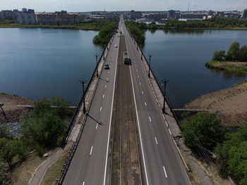 High angle view of highway by river in city