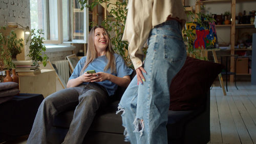 Smiling lesbian woman talking with girlfriend