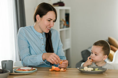 Mother playing with toys at home