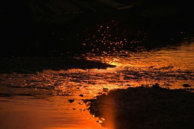 Scenic view of lake at sunset