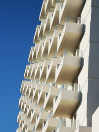 Low angle view of building against clear blue sky