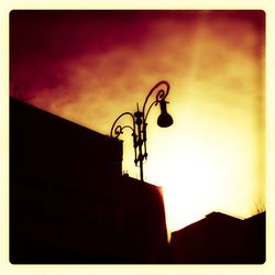 Low angle view of street light against sky