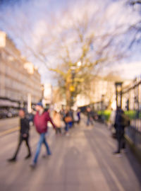 People walking on street in city