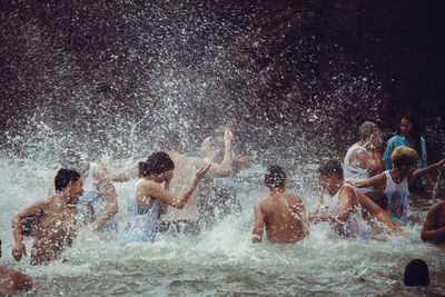 People enjoying in swimming pool