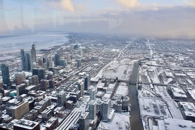 High angle view of buildings in city against sky