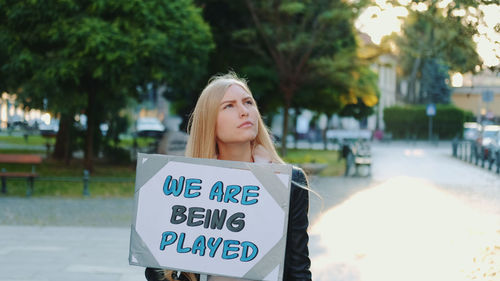 Portrait of a young woman standing outdoors