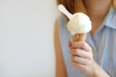 Cropped image of hand holding ice cream