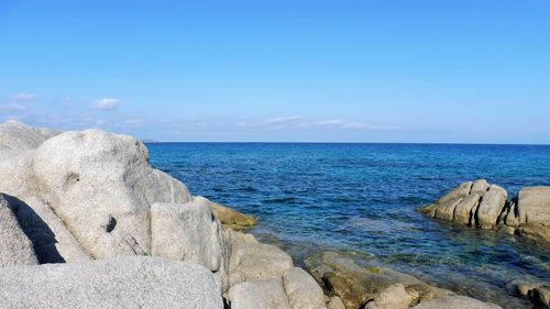 Scenic view of sea against blue sky