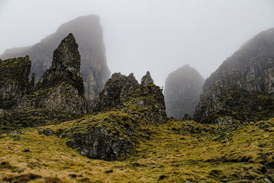 Panoramic view of rocks and mountains against sky