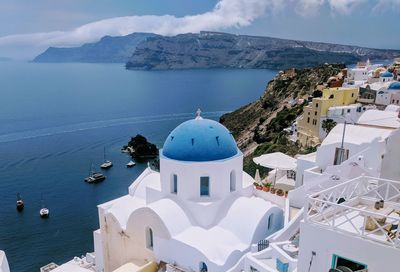 Panoramic view of sea and buildings against sky