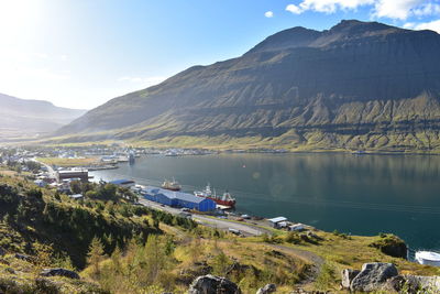 Scenic view of lake and mountains against sky