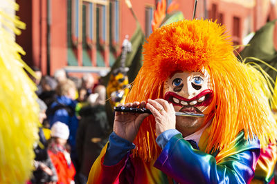 Close-up of person wearing clown costume during carnival