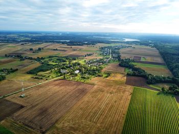 Aerial view of agricultural field against sky