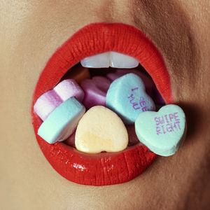 Cropped hand of woman holding pills