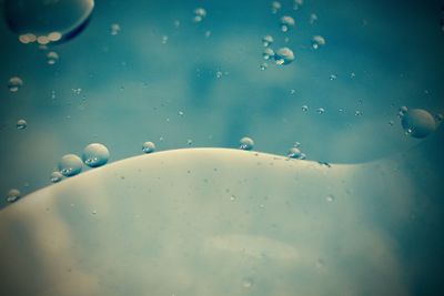 Close-up of water against blue sky