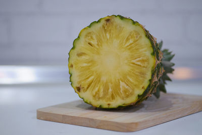 Close-up of lemon slice on cutting board