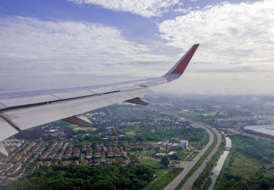 Aerial view of city against sky