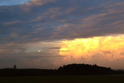 Silhouette landscape against sky during sunset